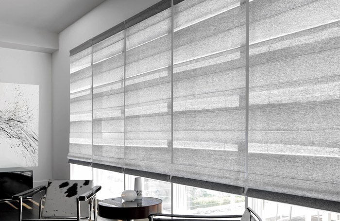 Light gray shades covering wide business window